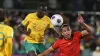 Australia’s Thomas Deng, left, and China’s Zhang Yuning during the World Cup qualifier in Adelaide (James Elsby/AP)