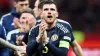 Andy Robertson applauds the fans after victory in Poland (PA)