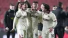 Harrison Burrows (centre) celebrates following his last-gasp winner (Nick Potts/PA)