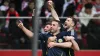 John McGinn, front, celebrates his Scotland goal in Warsaw (Rafal Oleksiewicz/PA)