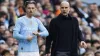 Pep Guardiola with Jack Grealish on the touchline (Richard Sellers/PA)