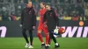 Harry Kane limps off after suffering a thigh injury against Borussia Dortmund (Federico Gambarini/dpa via AP)