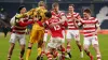 Doncaster celebrate after winning the penalty shootout (Martin Rickett/PA)