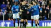 Rangers’ Nicolas Raskin (right) is shown a yellow card by referee Don Robertson (centre) (Steve Welsh/PA)